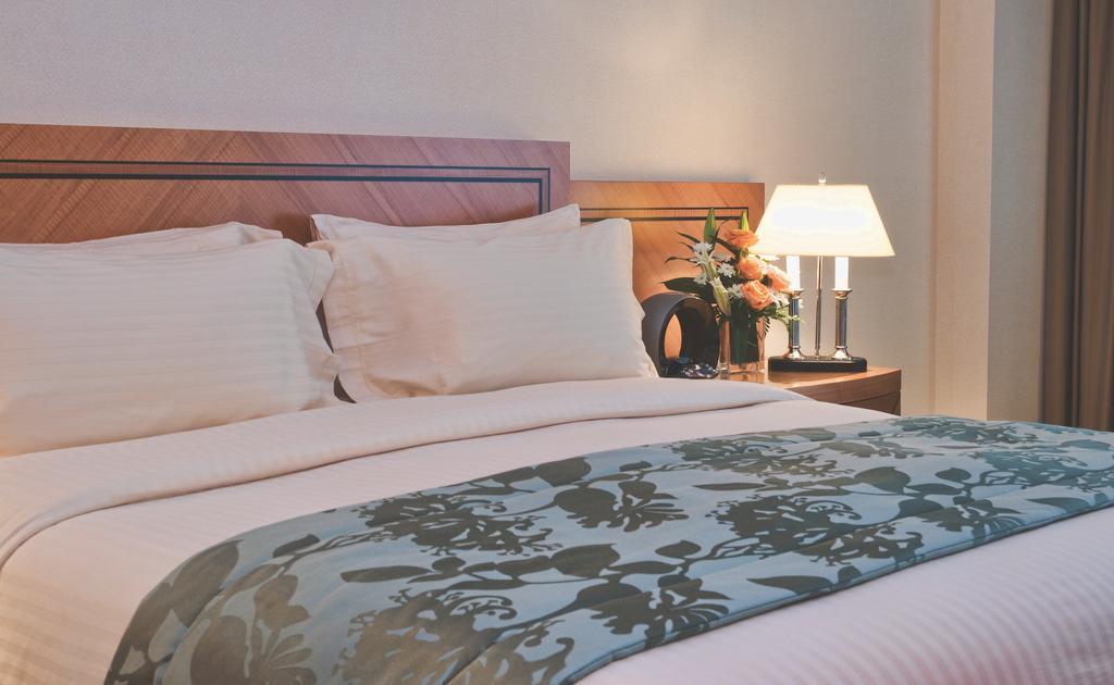 Wiseman Grand Hotel Doha Eksteriør bilde A bed runner